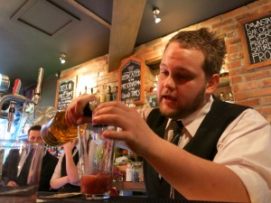 Sponsors winner Max Read pouring measures.