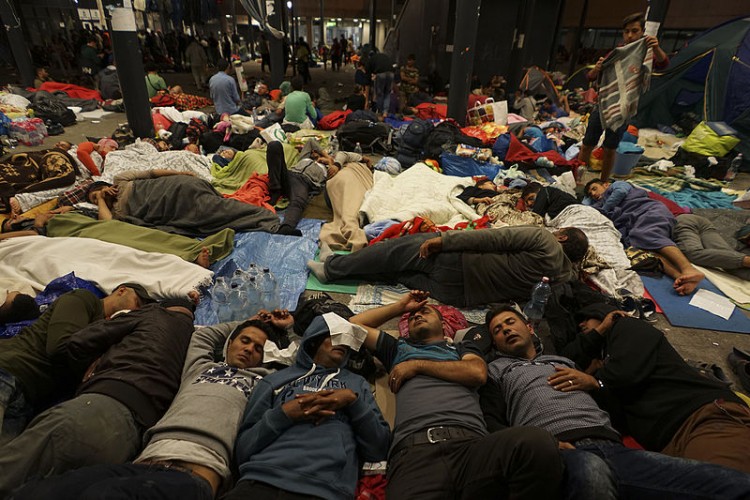 Syrian refugees sleeping on a rail way station floor. Photo: Mstyslav Chernov