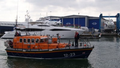 RNLI Lifeboat and Sunseeker Yacht in Poole Harbour Photo: Peter Elsdon