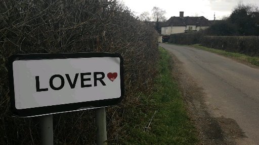 Lover village road sign with a heart on