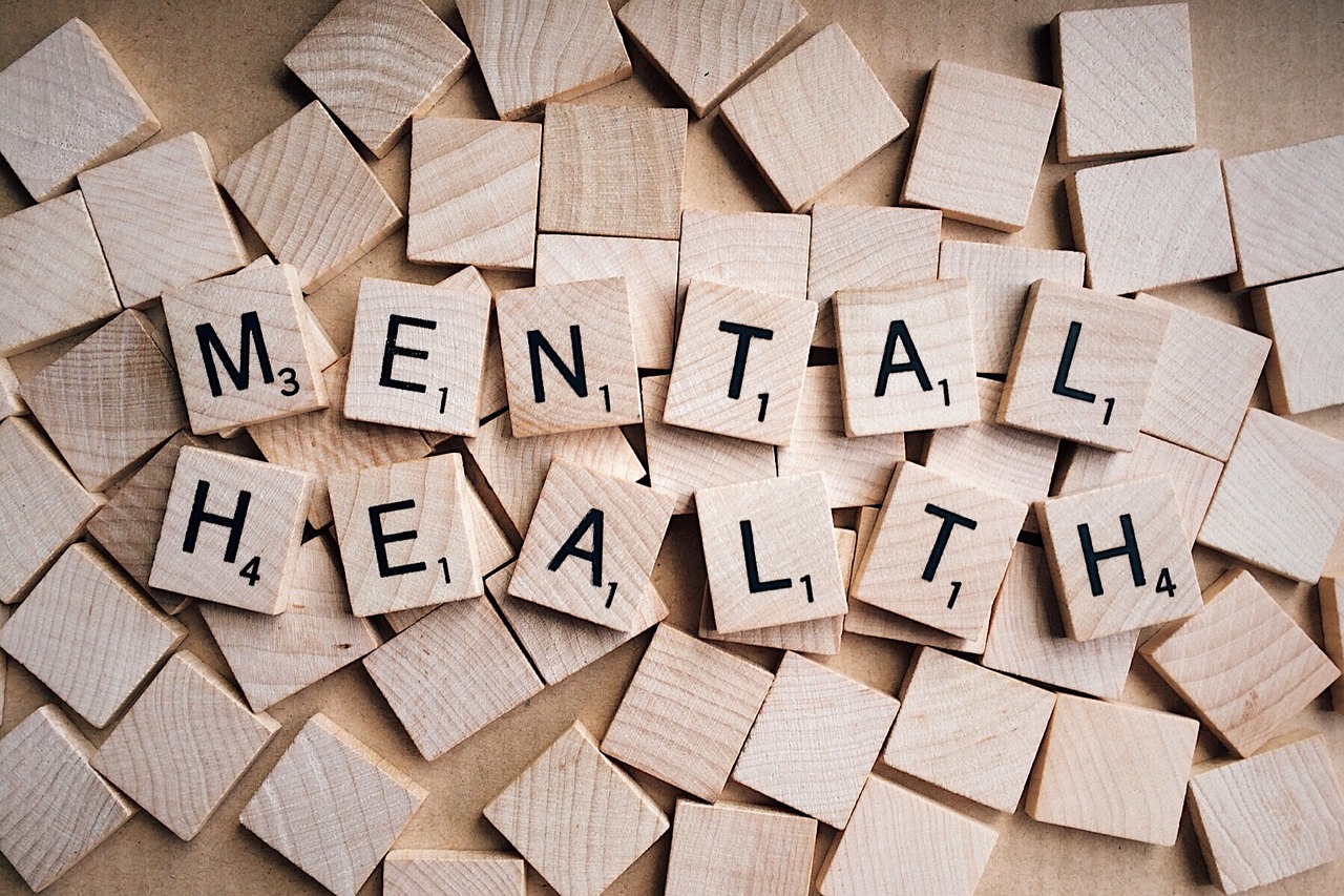 Scrabble letters spelling out the words 'mental health.'