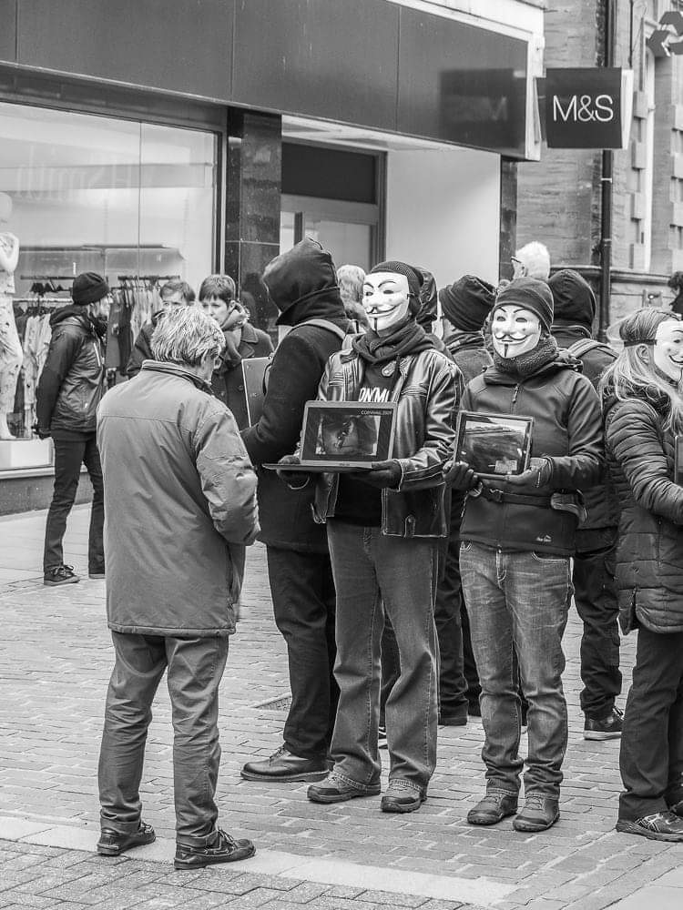 masked individuals demonstration