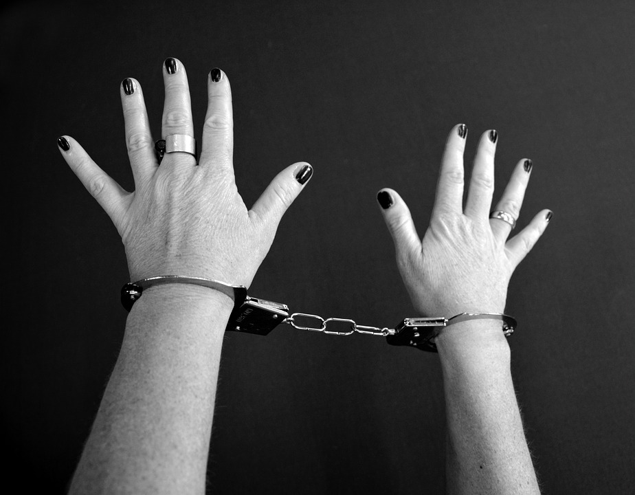 Womans hands in handcuffs