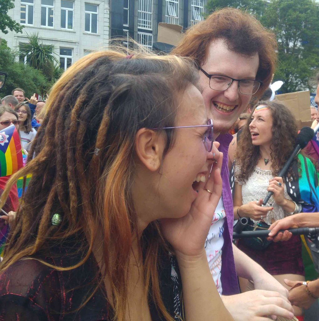 two people laughing at pride