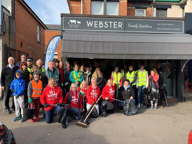 Winton locals outside Webster family butches before the high street clean up