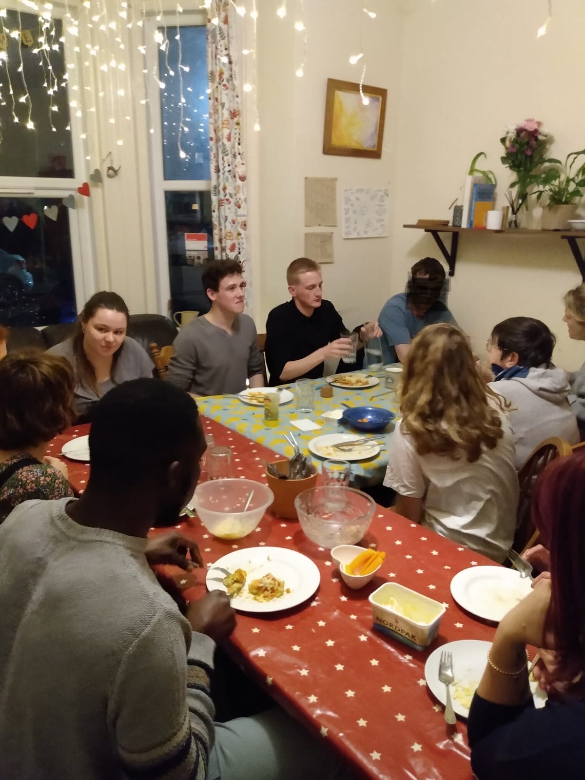 Photo shows friendly dinner in missional house where crack cocaine and drugs used to be peddled
