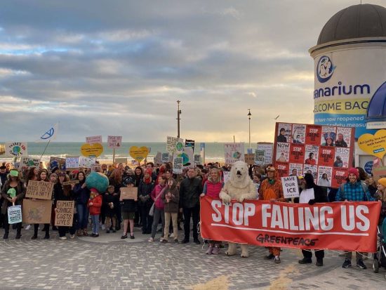 Photograph of Bournemouth COP26 Global Day for Action protestors at Bournemouth pier