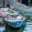 A boat on the bank of the polluted Yamuna River